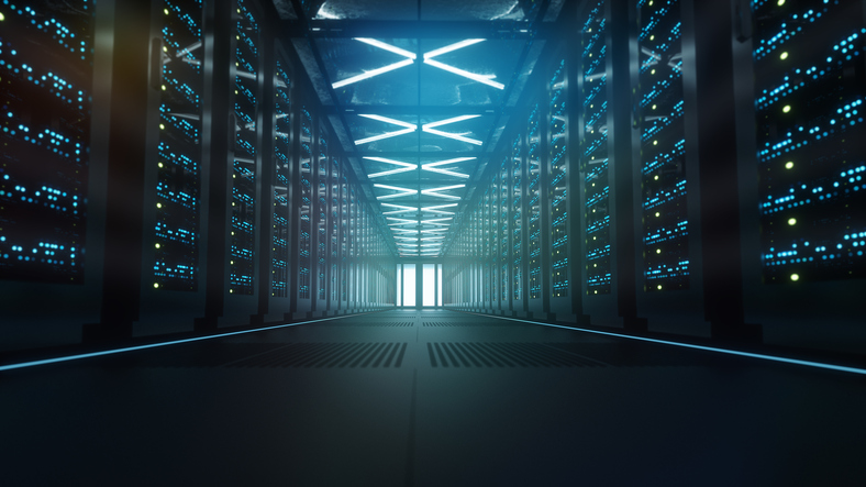 Dark data center corridor lined with server racks and glowing status lights